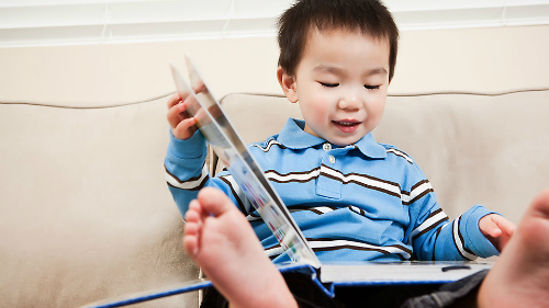 toddler-holding-book-7975-1417848597.jpg